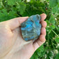 Held in palm of a Labradorite raw crystal, set to give a sense of weight.