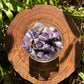 Detail shot of Grade AA Chevron Amethyst raw under natural light