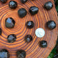 Profile shot of Garnet raw stone, associated with Energy, sourced from Brazil.