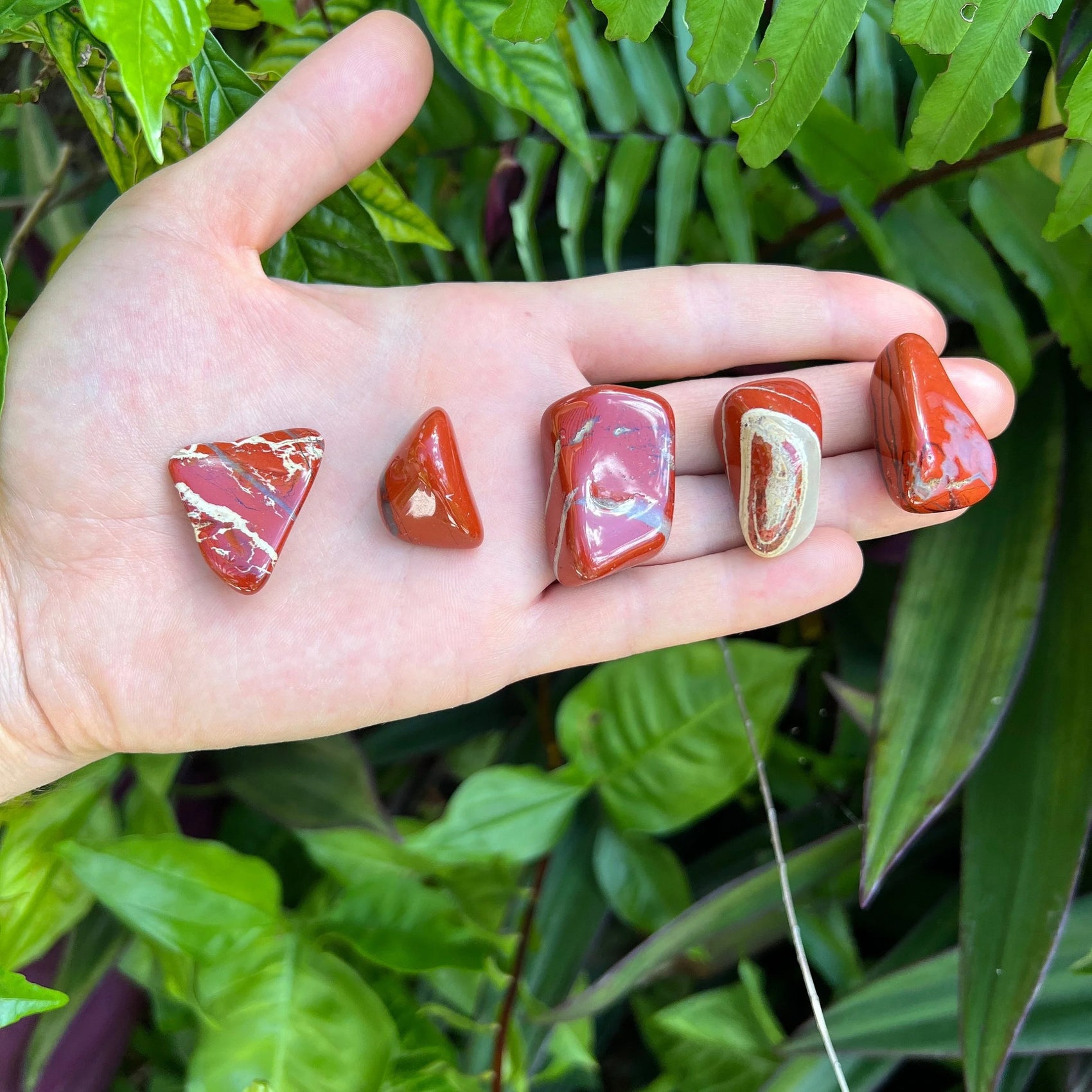Back view of Grade AA Red Jasper tumbled stone showing natural surface