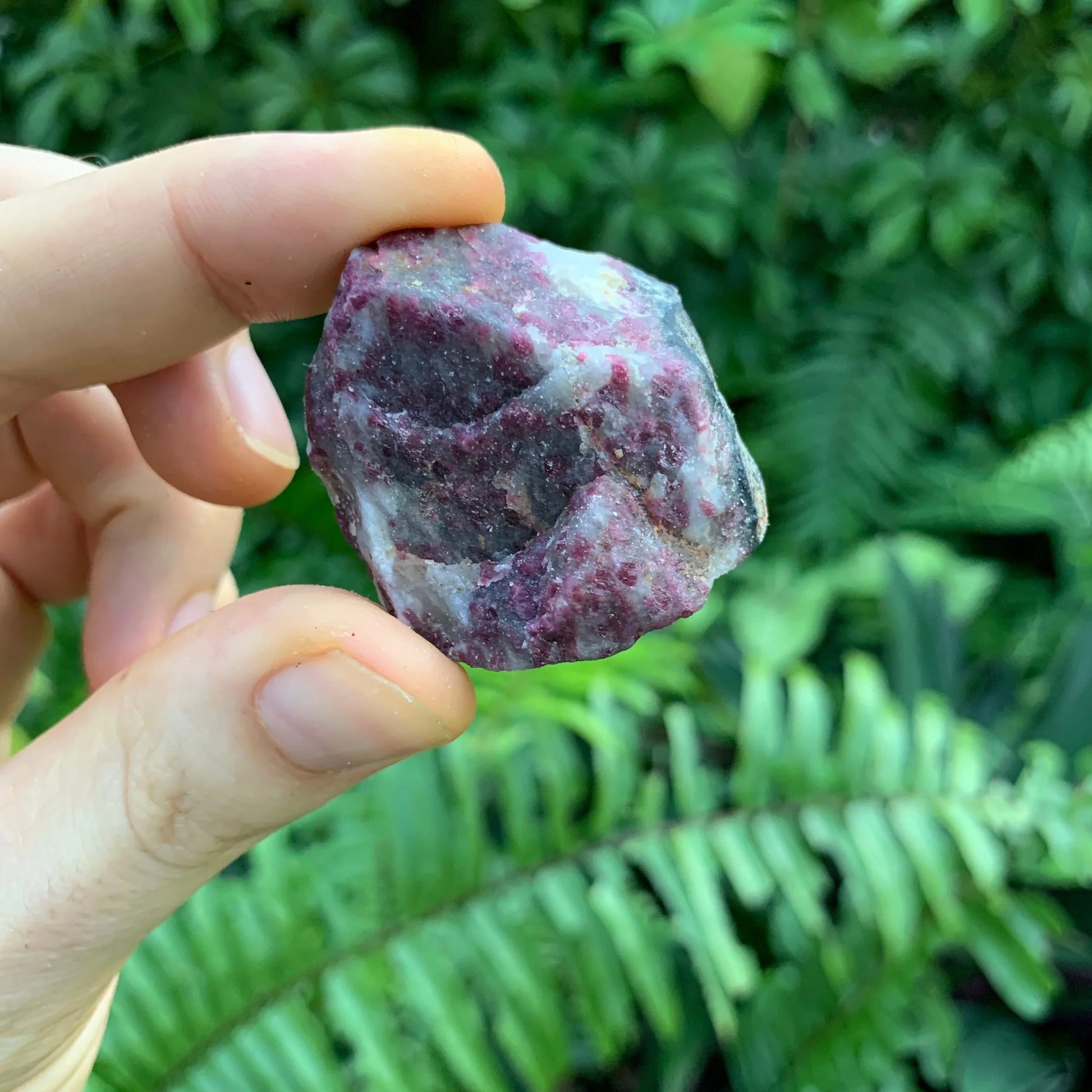 Looking down on Pink Tourmaline raw stone, showing natural sheen.