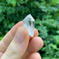 Back view of Grade AA Clear Quartz point showing natural surface