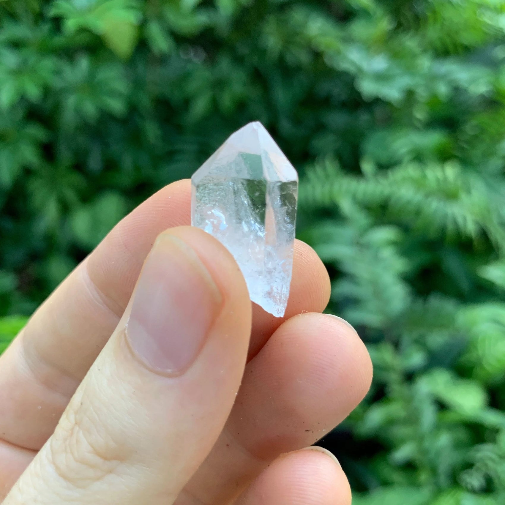 Back view of Grade AA Clear Quartz point showing natural surface