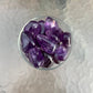 Side angle of Amethyst tumbled stone, from Brazil.