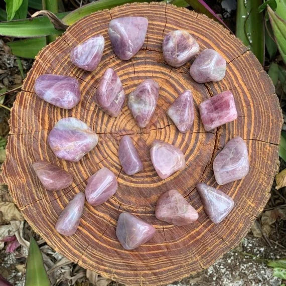 Opposite side of Blue Rose Quartz tumbled stone, showing matte finish.
