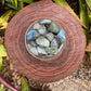 In context of a Labradorite tumbled stone, from Atsimo-Andrefana, Madagascar, with weight visible in the palm.