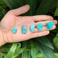 Profile shot of Amazonite raw stone, showing honest grain.