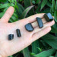 Detail shot of Grade AA Black Tourmaline raw under natural light