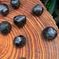 Back view of Grade AA Garnet raw showing natural surface