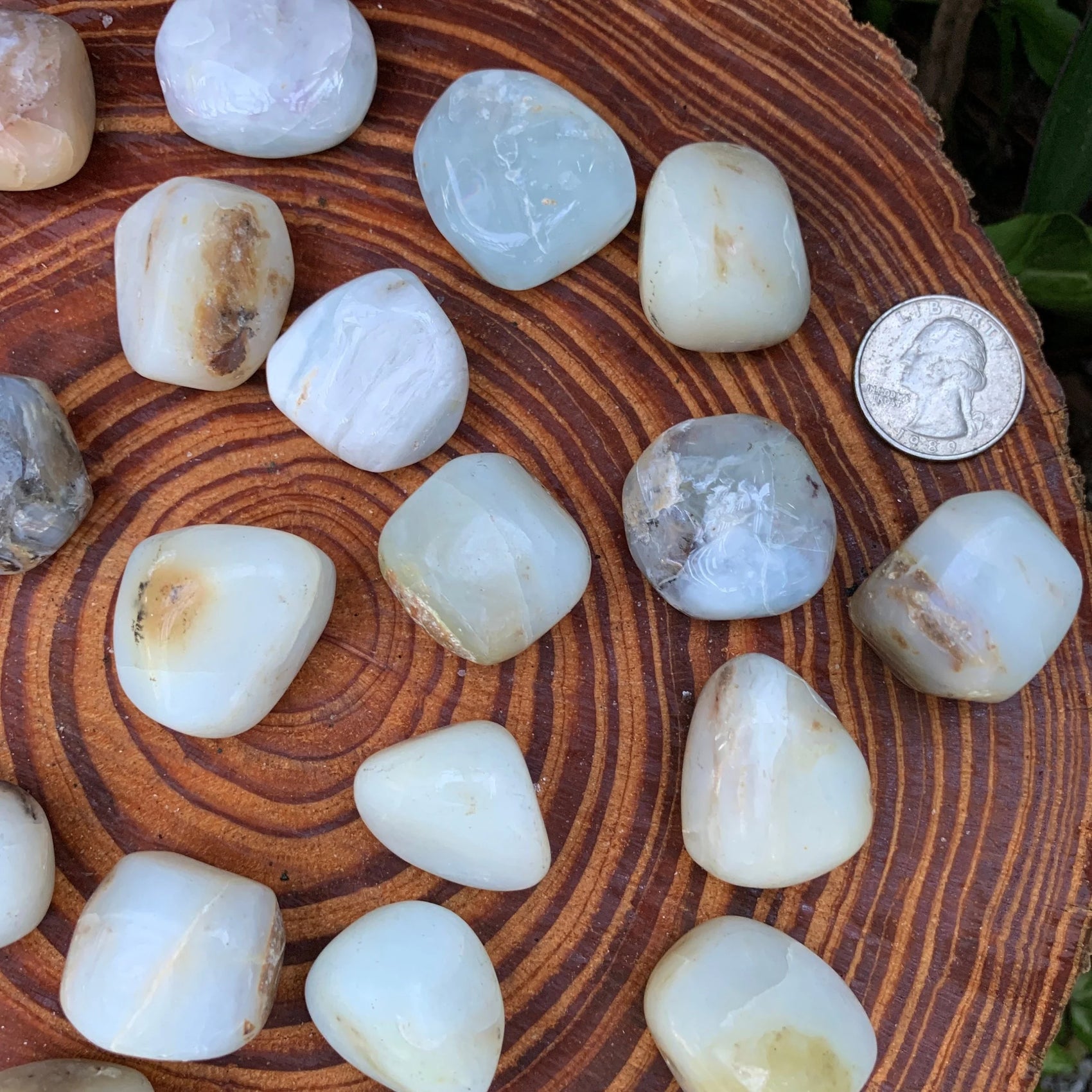 Side perspective of Blue Opal tumbled stone, showing subtle veining, often paired with practices around Emotional Healing.