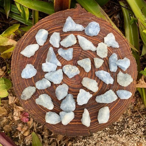 Lifestyle still of Blue Calcite raw crystal, shown for proportion against the hand.