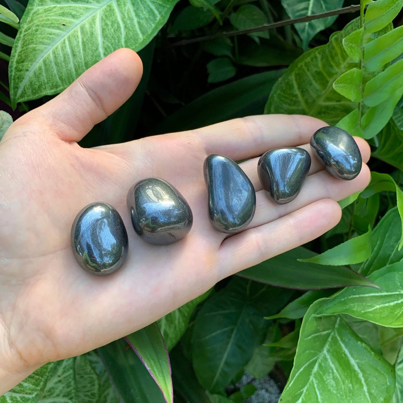 Close-up of Hematite tumbled stone from Brazil, soothing wellness stone for Stress Relief