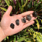 Quiet study of Smoky Quartz tumbled stone, with form visible in context.