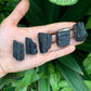 Side angle of Grade AA Black Tourmaline raw stone, associated with Protection, from Brazil.