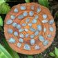 Back view of Grade AA Celestite tumbled stone showing natural surface