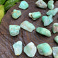 Plan view of green Chrysoprase tumbled stone, showing natural texture.