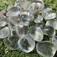 Side profile of Grade AAA Clear Quartz tumbled stone with natural form and inclusions