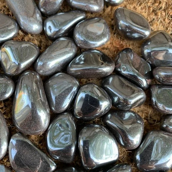 Back view of Grade AA Hematite tumbled stone showing natural surface