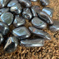 Size comparison with a Hematite tumbled stone drawn on for Grounding.