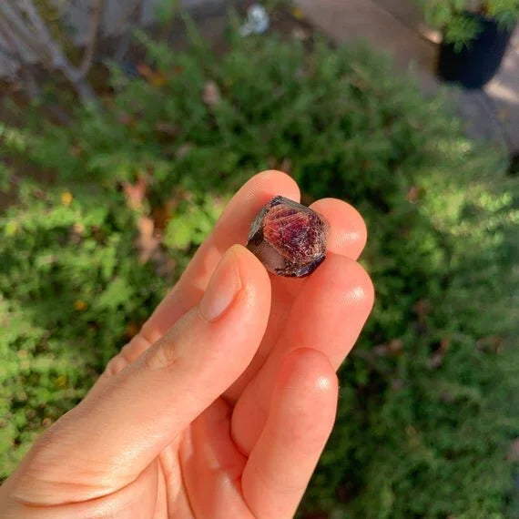 Back view of Grade AA Garnet raw showing natural surface