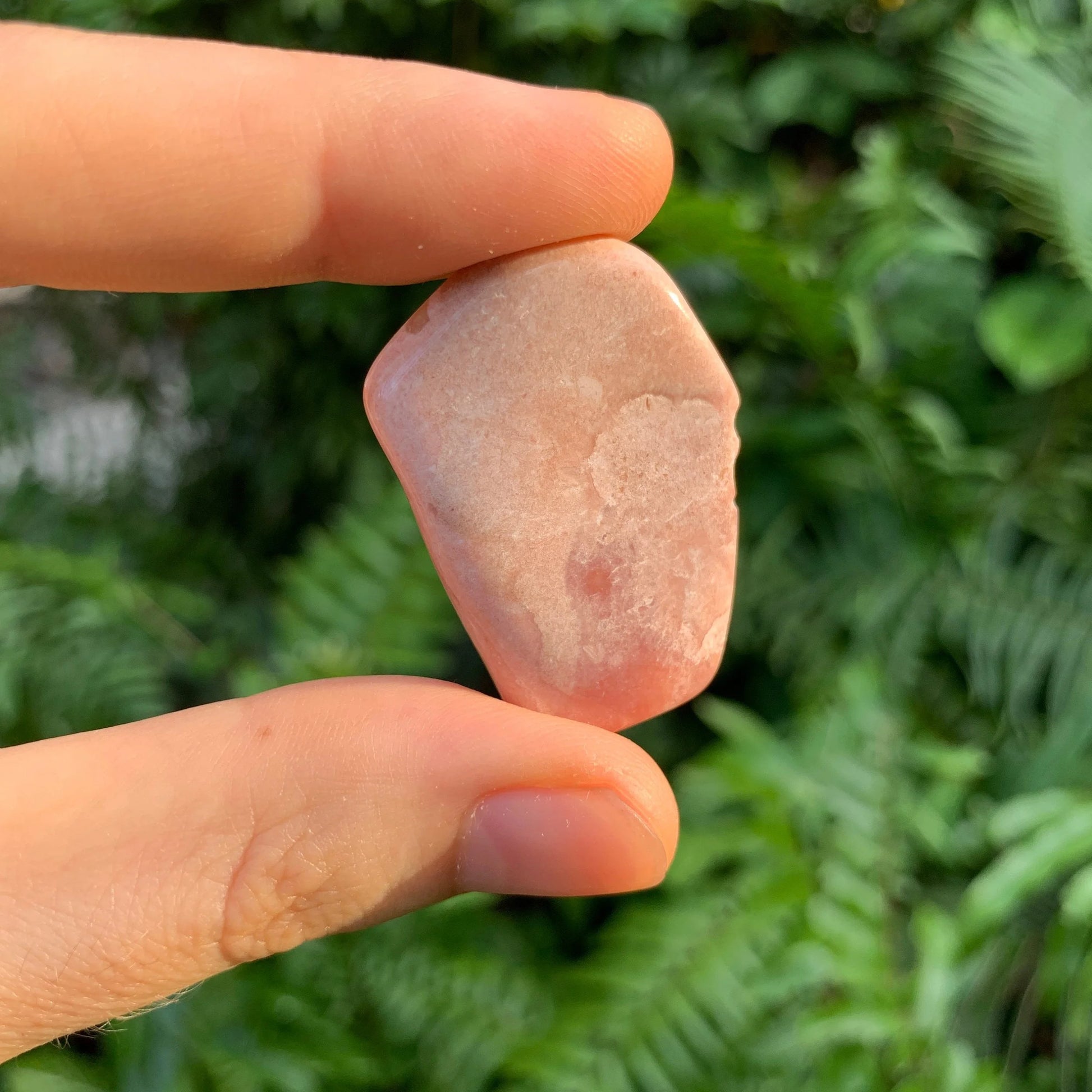 Alternate side of Pink Opal tumbled stone, often paired with practices around Love and Self Love, showing characteristic finish.