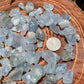 Side perspective of blue Celestite raw stone, often paired with practices around Stress Relief, sourced from Sakoany, Madagascar.