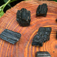 Back view of Grade AA Black Tourmaline raw showing natural surface