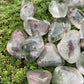 Worktop view of Lodolite stone, from Brazil, captured against a quiet backdrop.