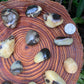 Bird's-eye view of Septarian tumbled stone, from Madagascar, showing matte finish.