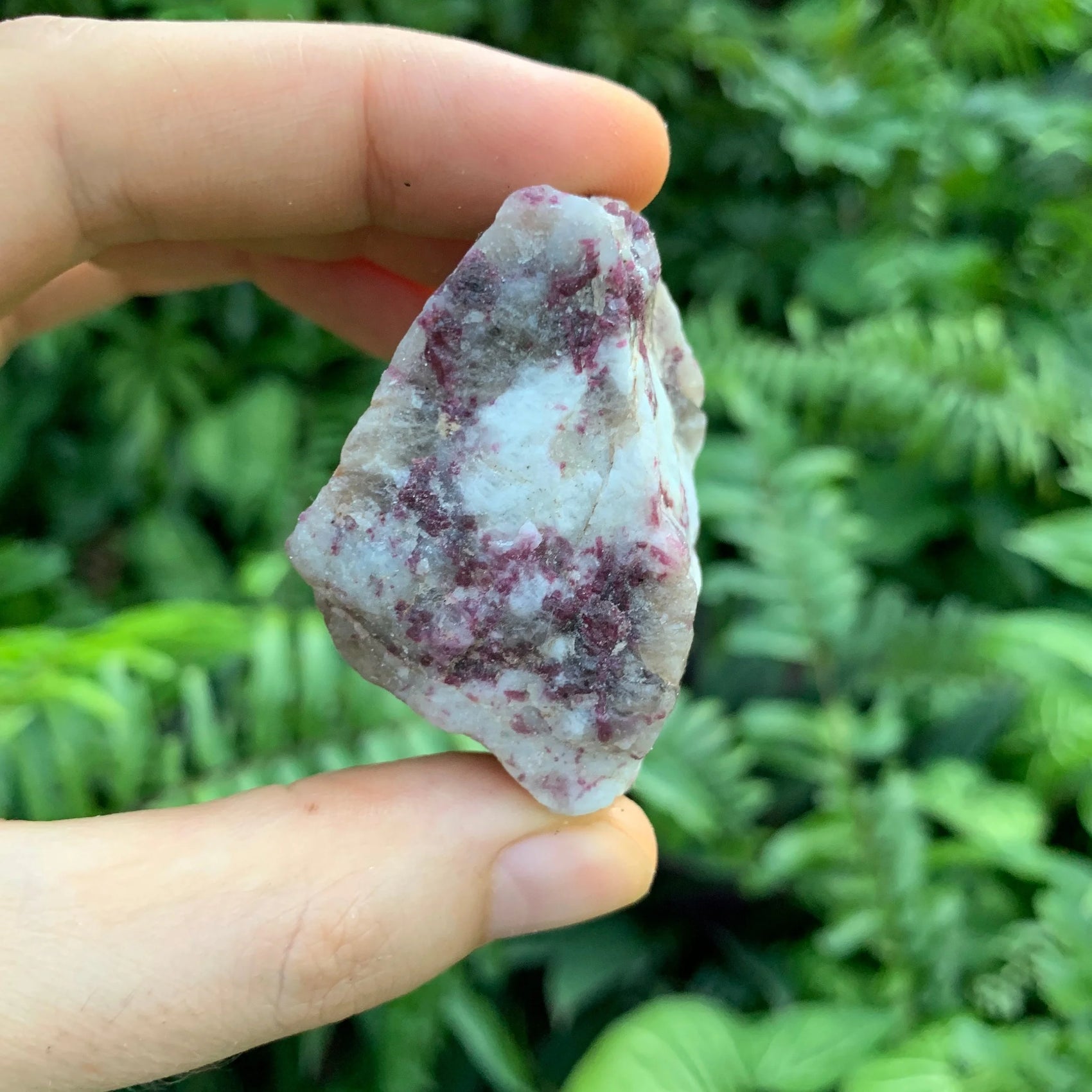 Bottom side of Pink Tourmaline raw stone, from Vakinankaratra, Madagascar, showing characteristic color.