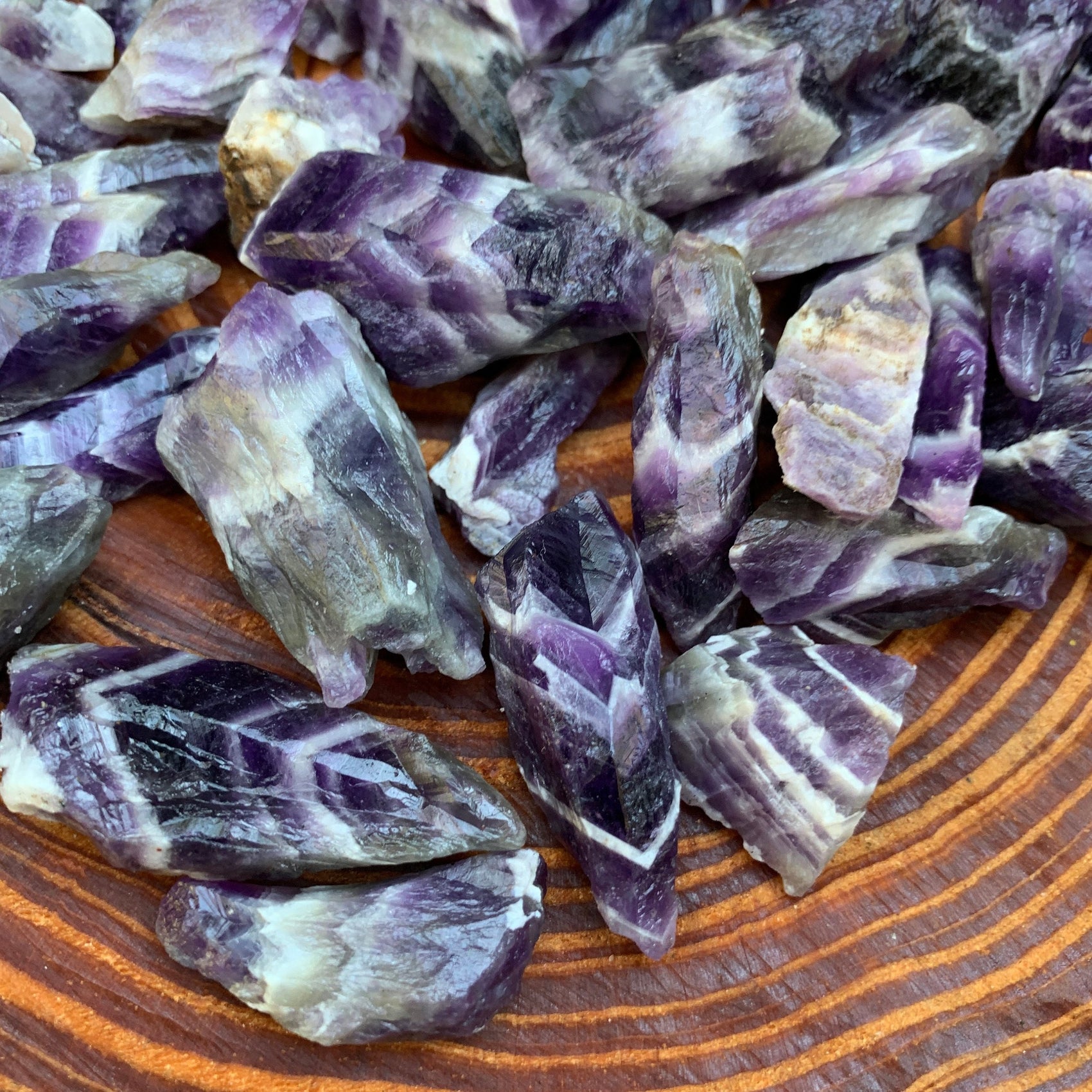 Back view of Grade AA Chevron Amethyst raw showing natural surface