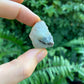 Back view of Grade A Prehnite raw showing natural surface