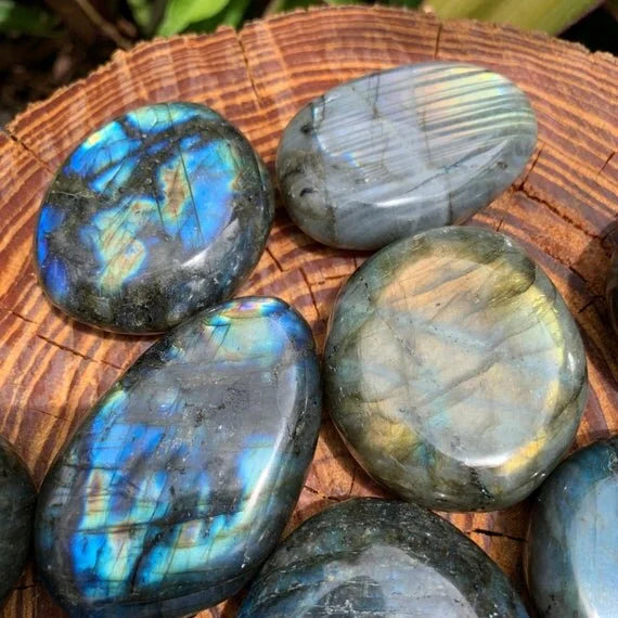Detail shot of Grade AAA Labradorite palm stone under natural light