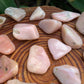 Full profile of Grade A Pink Opal tumbled stone ready to ship from Beyond Bohemian