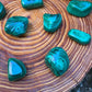 Full profile of Grade AA Malachite tumbled stone ready to ship from Beyond Bohemian