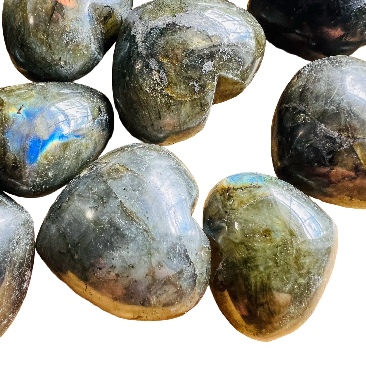 In-hand view of a single Labradorite polished heart from Madagascar.