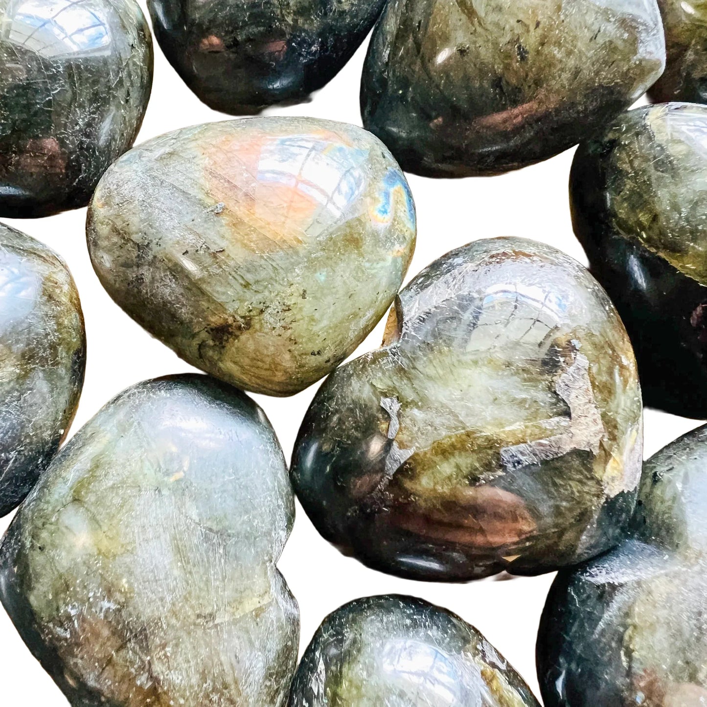 Full piece view of Labradorite stone, from Atsimo-Andrefana, Madagascar, shown for proportion against the hand.