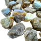 Group of Labradorite raw stones showing blue and gold rainbow flash on natural rough form, AA grade Madagascar