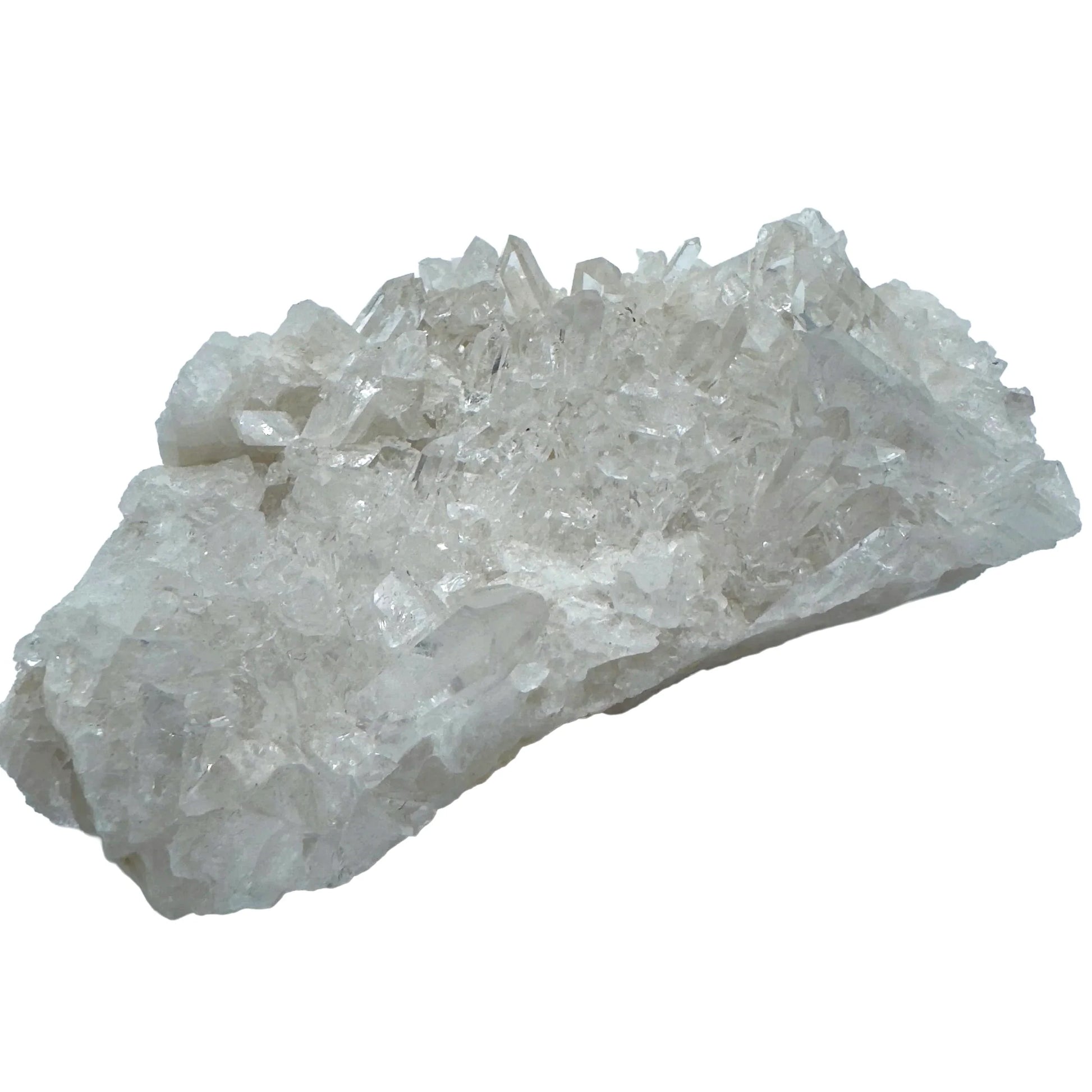 Natural light view of a Clear Quartz specimen held against natural backdrop, sourced from Brazil.
