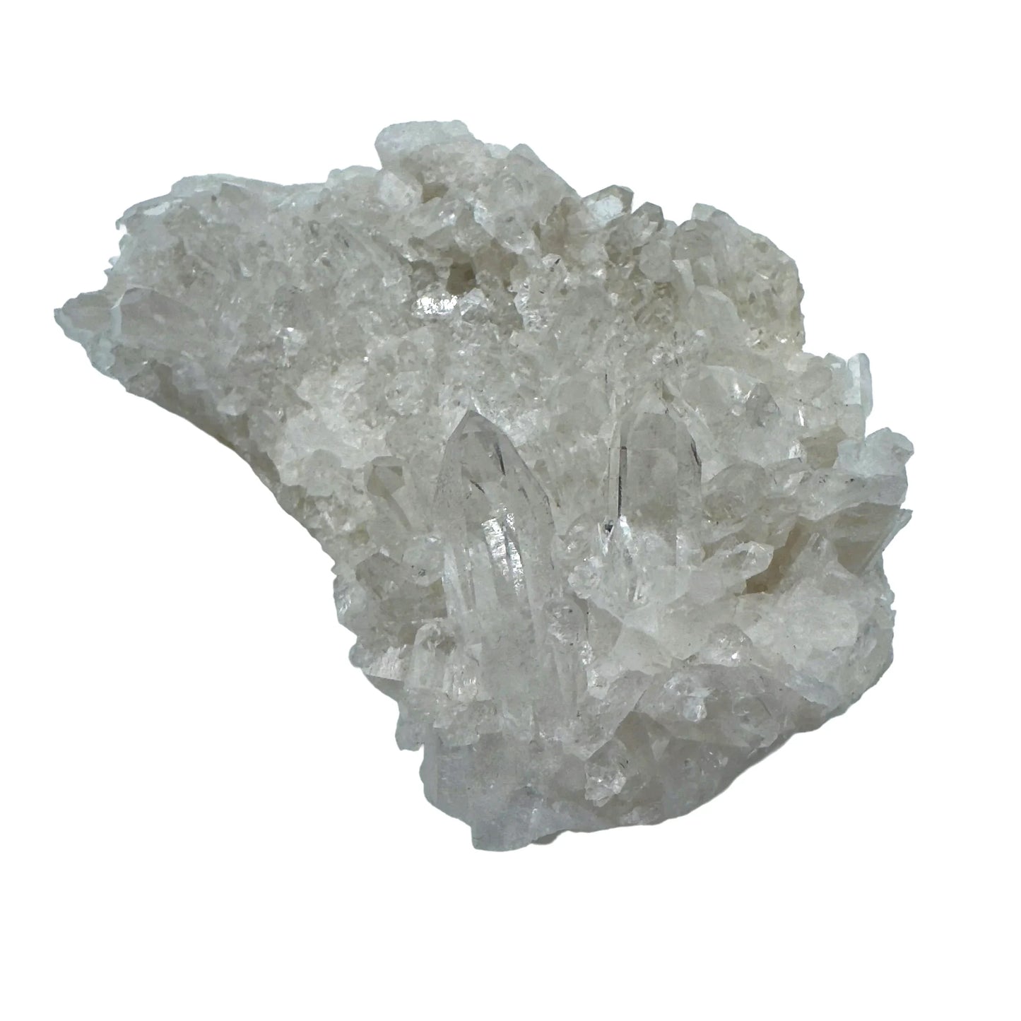 Holding a Clear Quartz specimen, from Rio Grande do Sul, Brazil, set against a soft neutral surface.