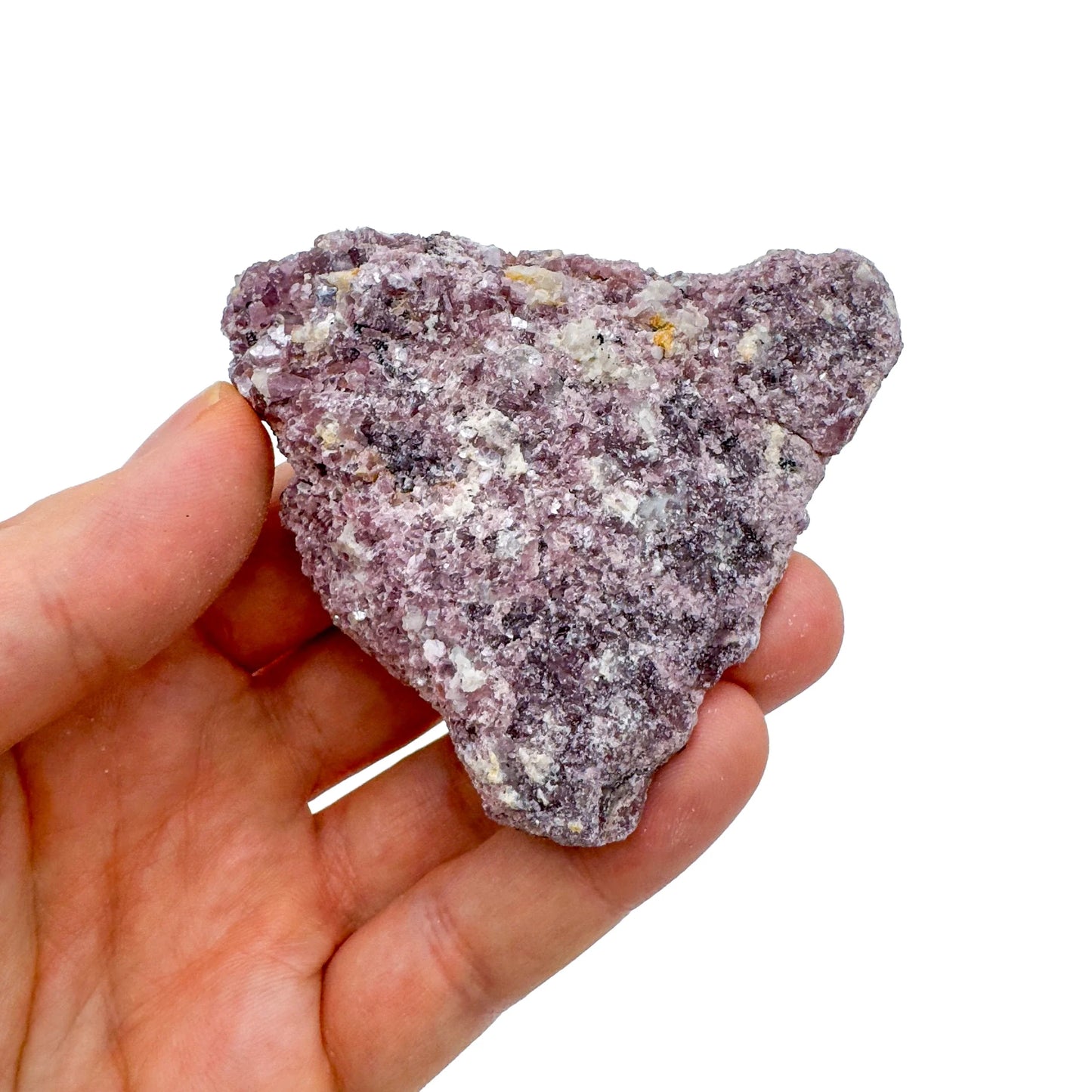 Palm-scale view of a single Lepidolite specimen from Brazil.