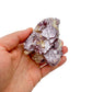 Resting display of Lepidolite specimen, from Minas Gerais, Brazil, associated with Emotional Healing, shown for shape and scale.