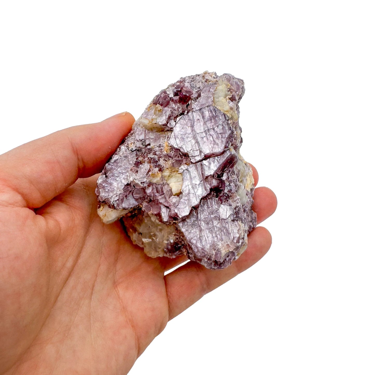 Resting display of Lepidolite specimen, from Minas Gerais, Brazil, associated with Emotional Healing, shown for shape and scale.
