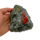 Worktop view of Bloodstone specimen, from Hhohho, Eswatini, traditionally used for Protection, with weight visible in the palm.