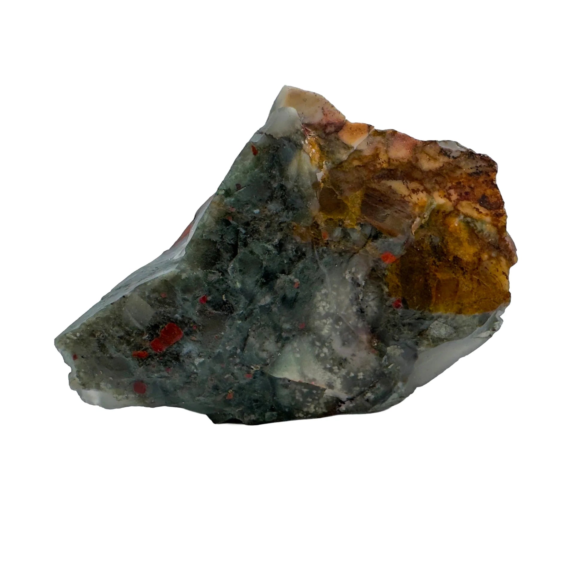 Daylight view of a Bloodstone specimen held against natural backdrop, from Hhohho, Eswatini.