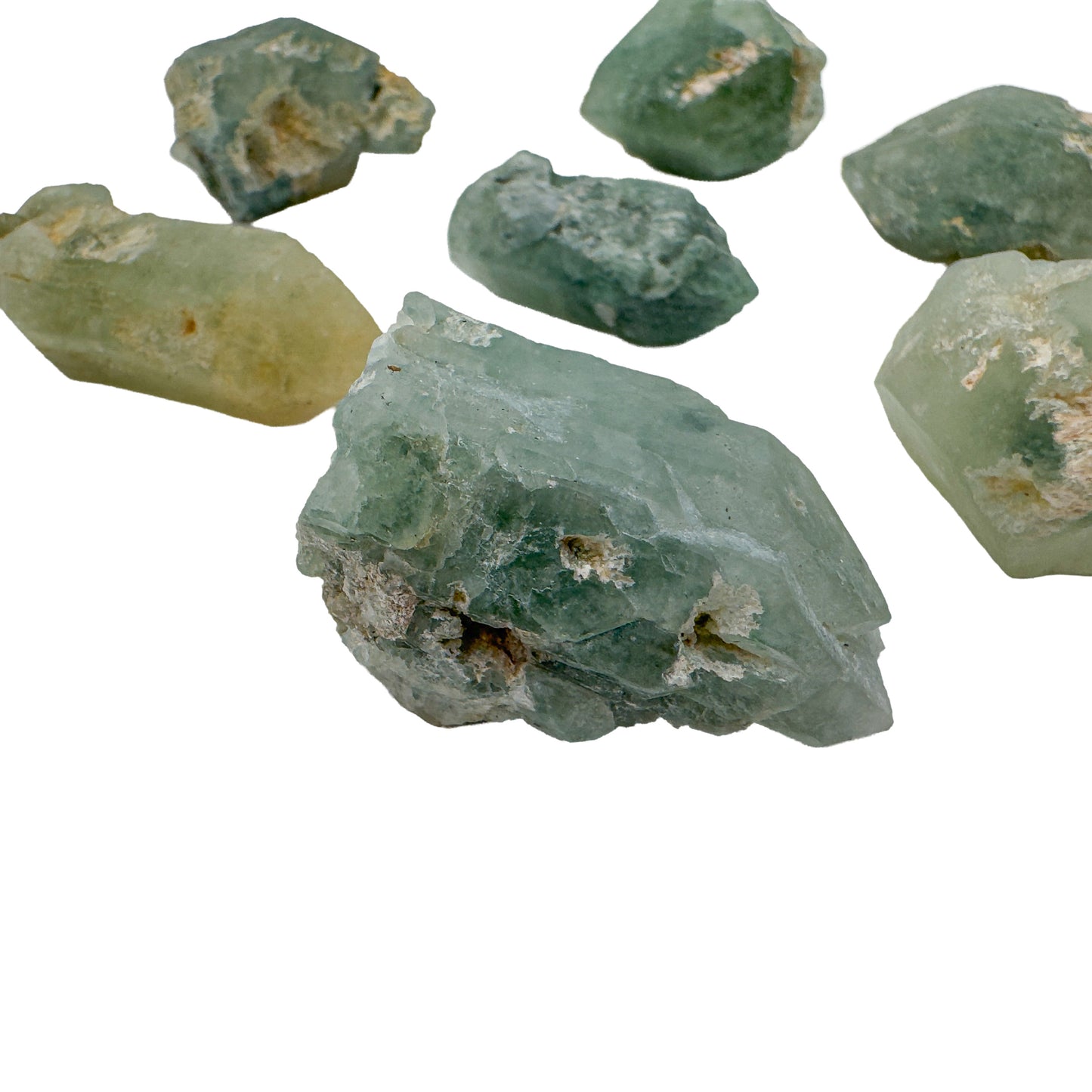 Close view of five chlorite quartz points with a broad pale green crystal in the foreground