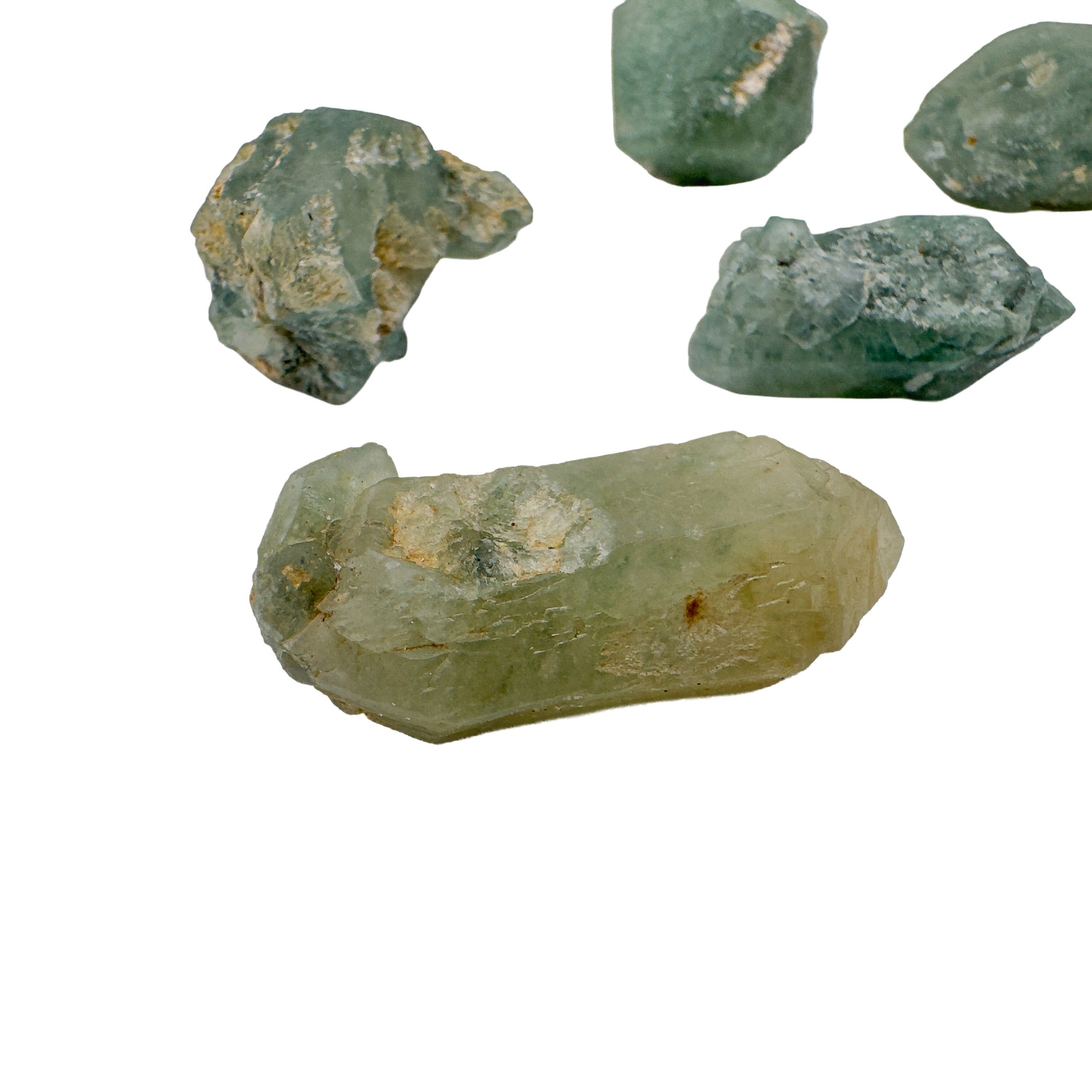 Four chlorite quartz raw crystal points with a long yellow green terminated point at the base