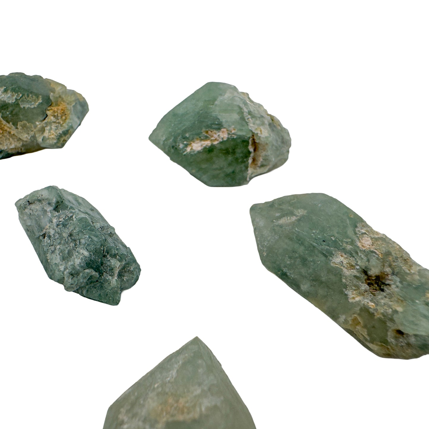 Five chlorite quartz points at 1 to 1.50 inches showing chlorite phantoms and pale matrix on the faces