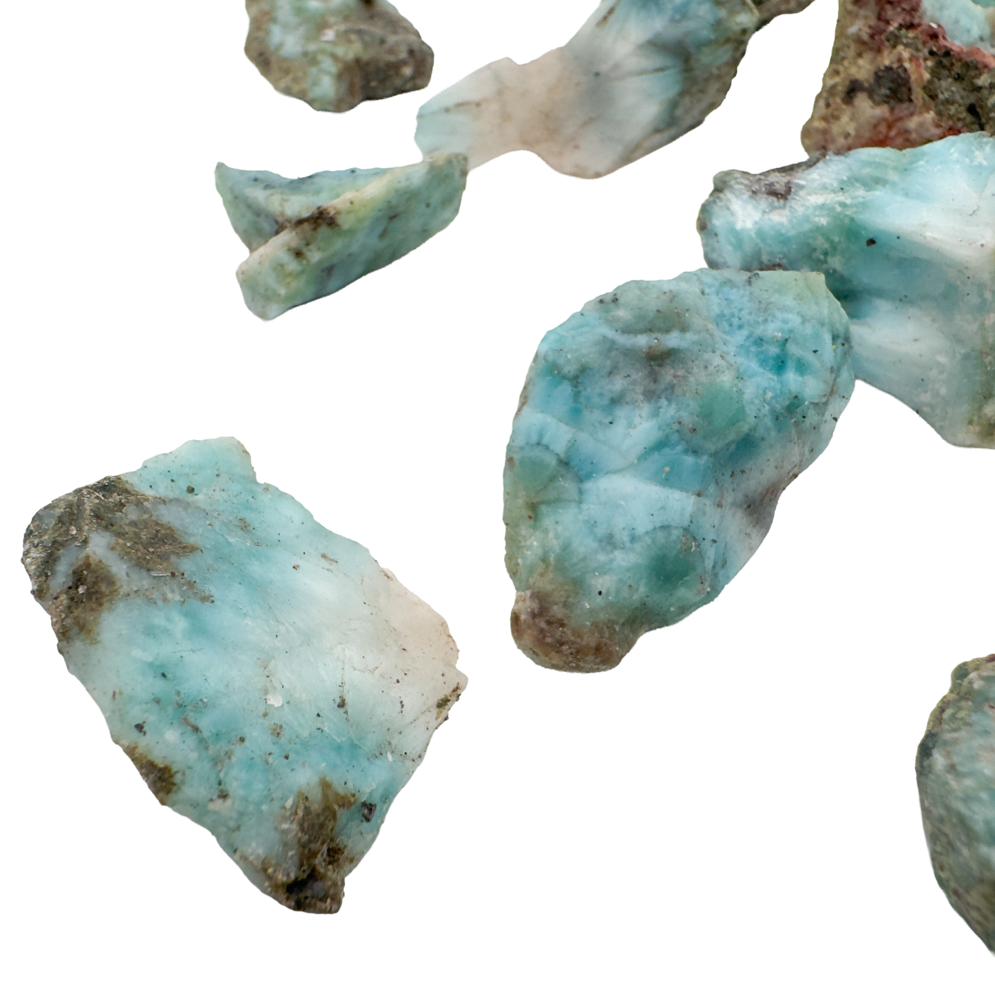Larimar rough pieces angled to show natural broken faces and blue to white banding, 0.5 to 1 inch