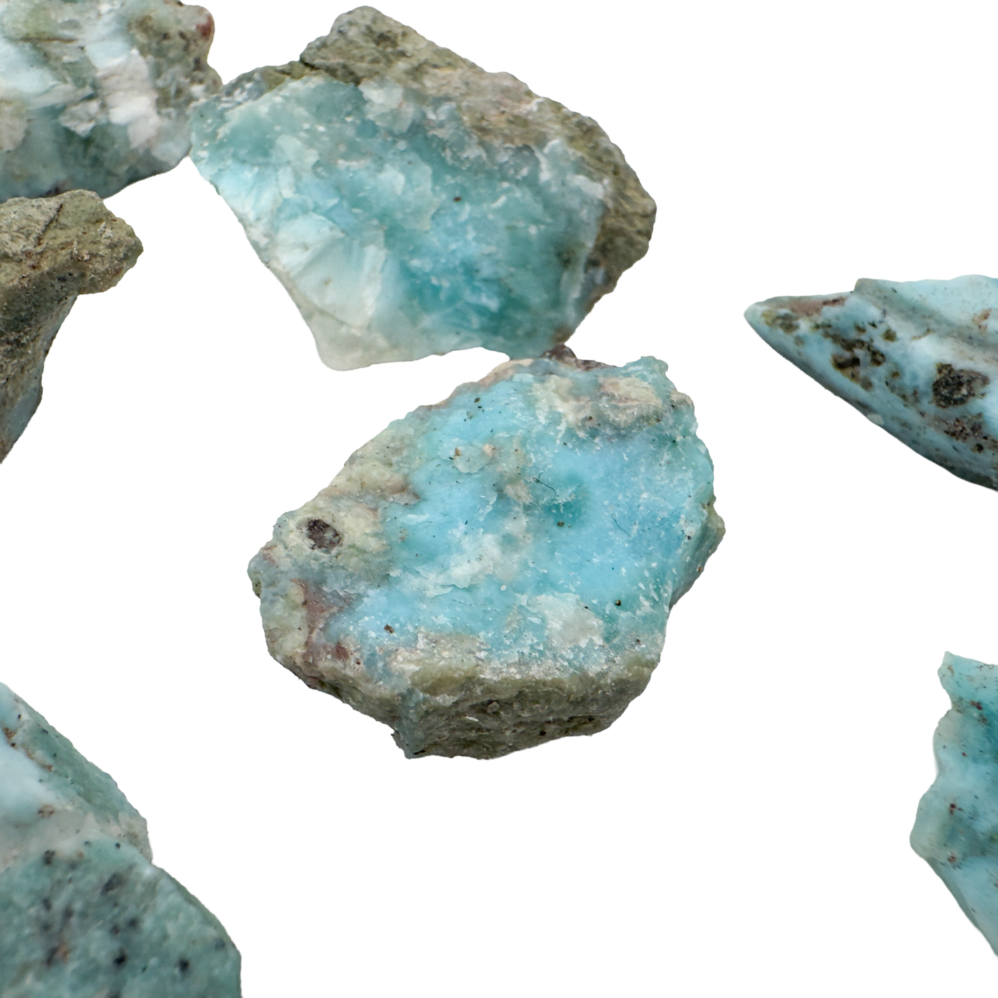 Larimar raw stone detail, jojoba oil finish deepening the natural blue, Barahona Province